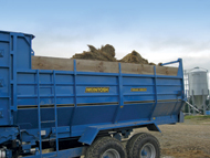 Round bales loaded into wagon ready to be fed out